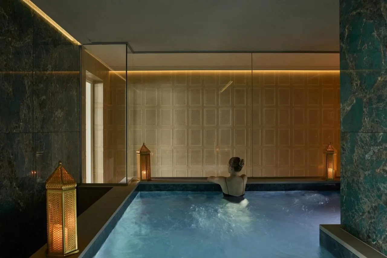Guest relaxing in the indoor swimming pool at Milestone Hotel Kensington in London