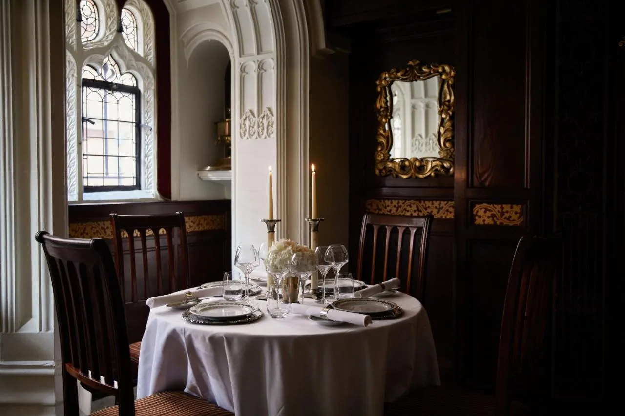 Elegant dining room with white tablecloths at Milestone Hotel Kensington