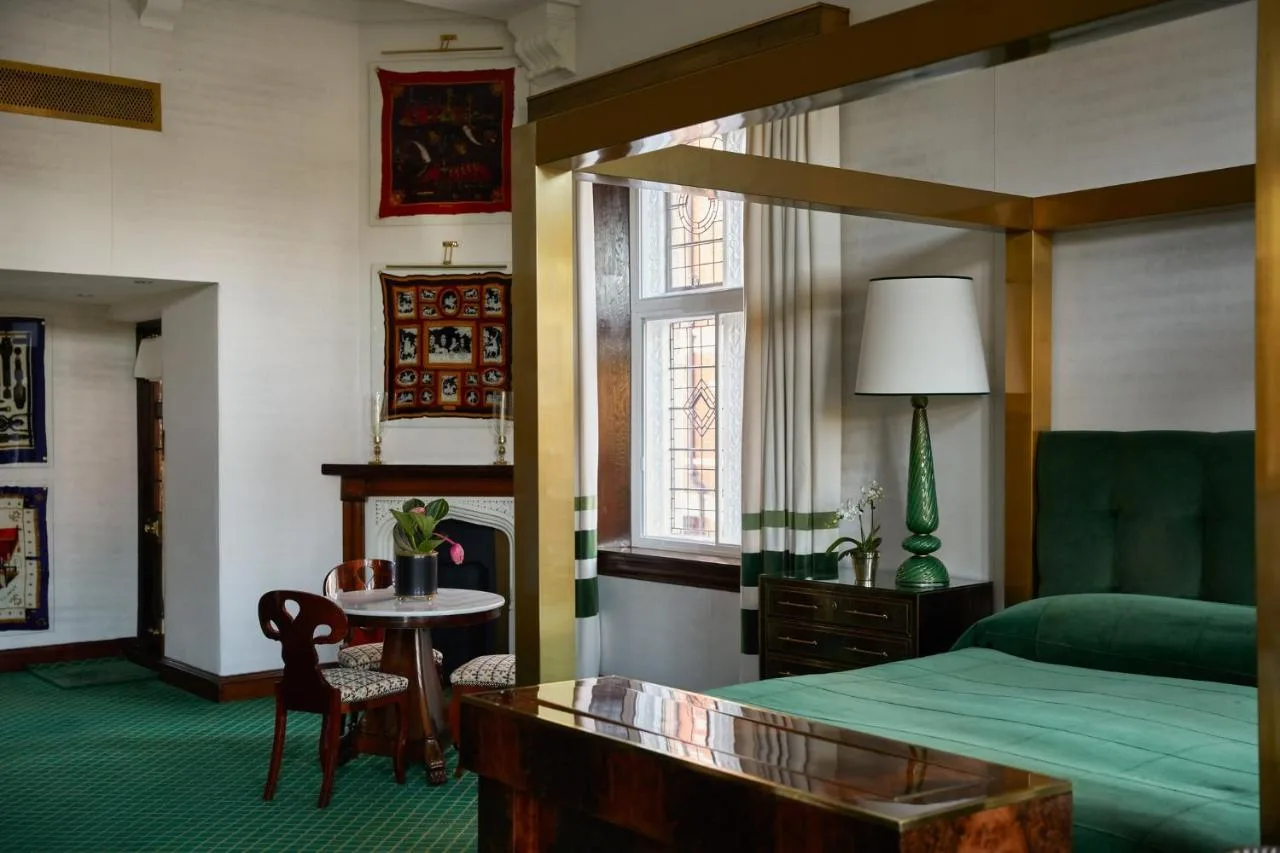 Individually designed bedroom with antique furnishings at Milestone Hotel Kensington