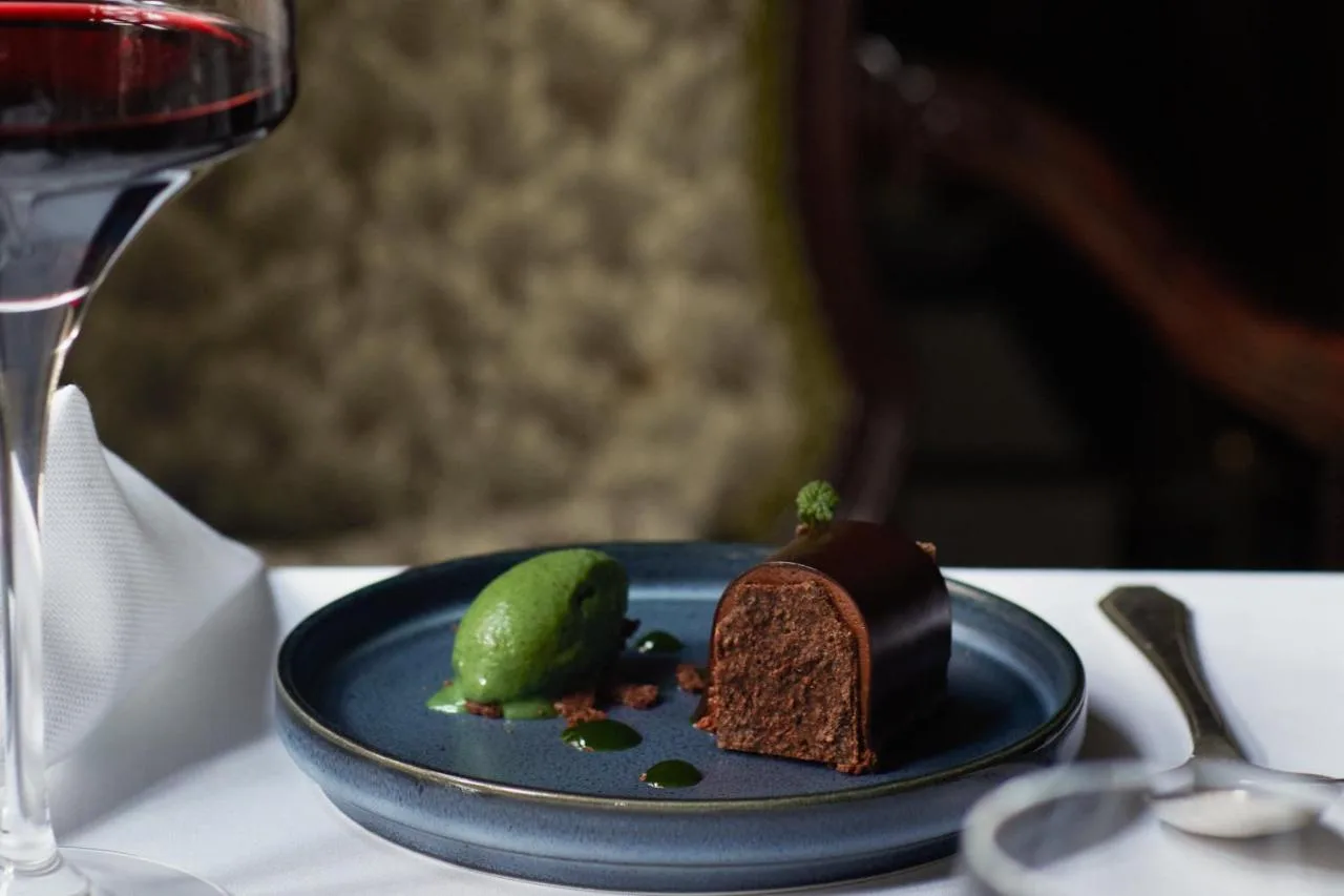 Dessert plate with a glass of wine at Milestone Hotel Kensington
